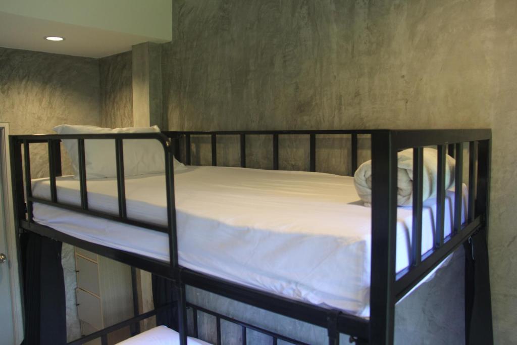 Postel nebo postele na pokoji v ubytování Yangyai Garden Lodge