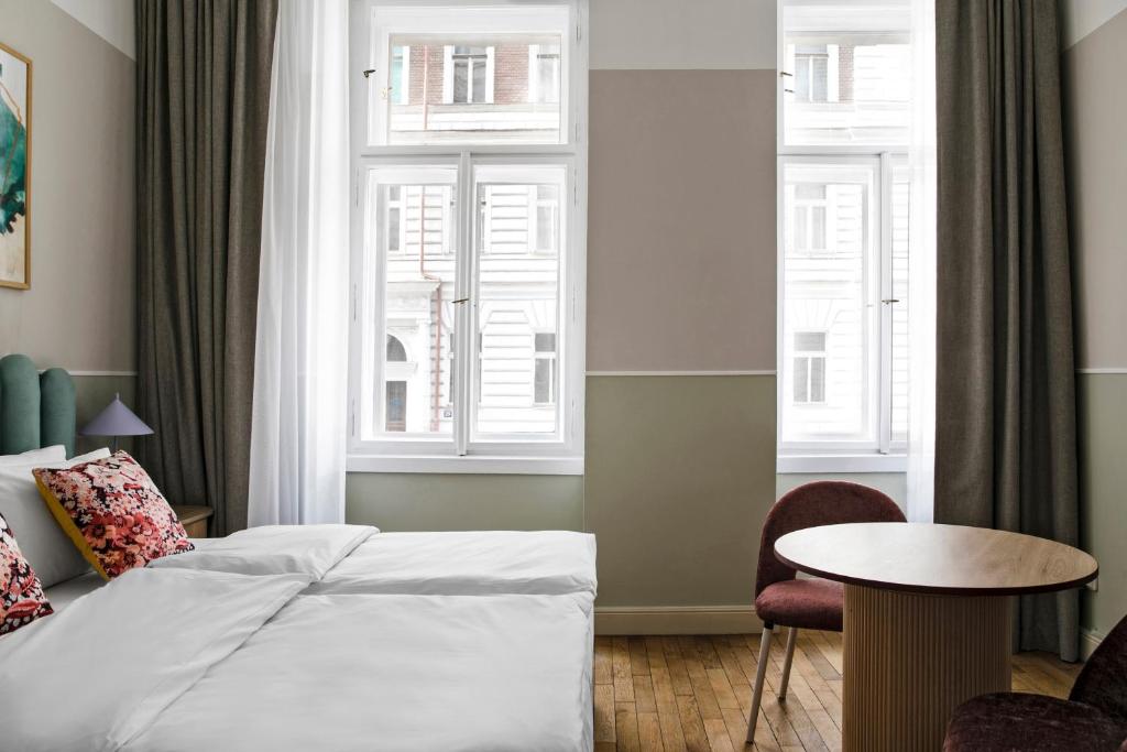 Postel nebo postele na pokoji v ubytování Numa Prague Flow