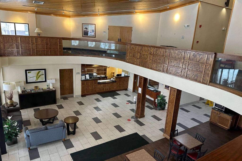 an overhead view of a lobby with a staircase at Baymont by Wyndham South Bend Near Notre Dame in South Bend