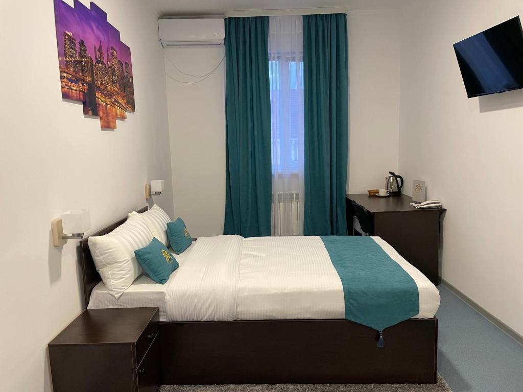Postel nebo postele na pokoji v ubytování Apec Hotel