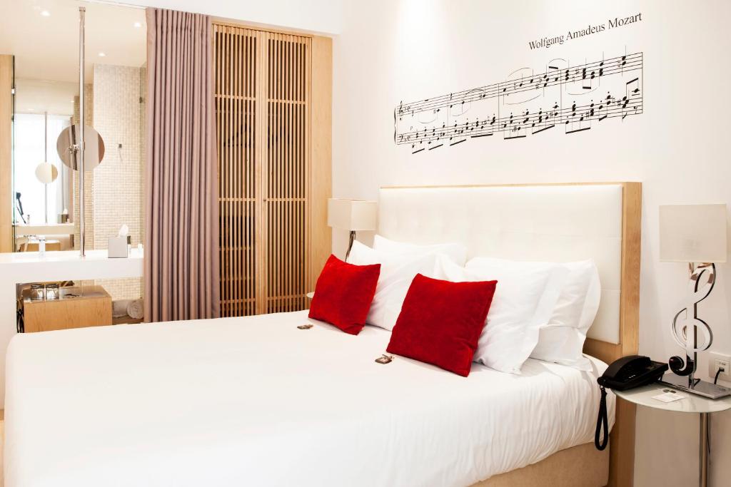 Ένα ή περισσότερα κρεβάτια σε δωμάτιο στο Hotel da Música
