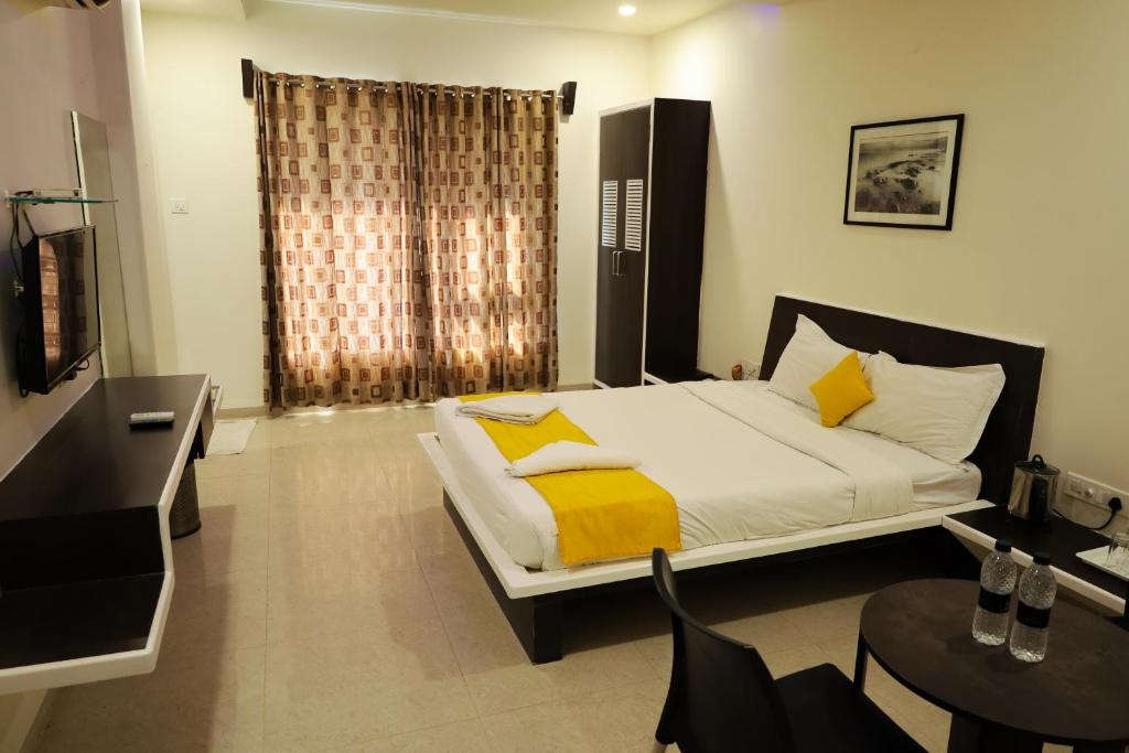 Postel nebo postele na pokoji v ubytování Hotel Sai Bansi