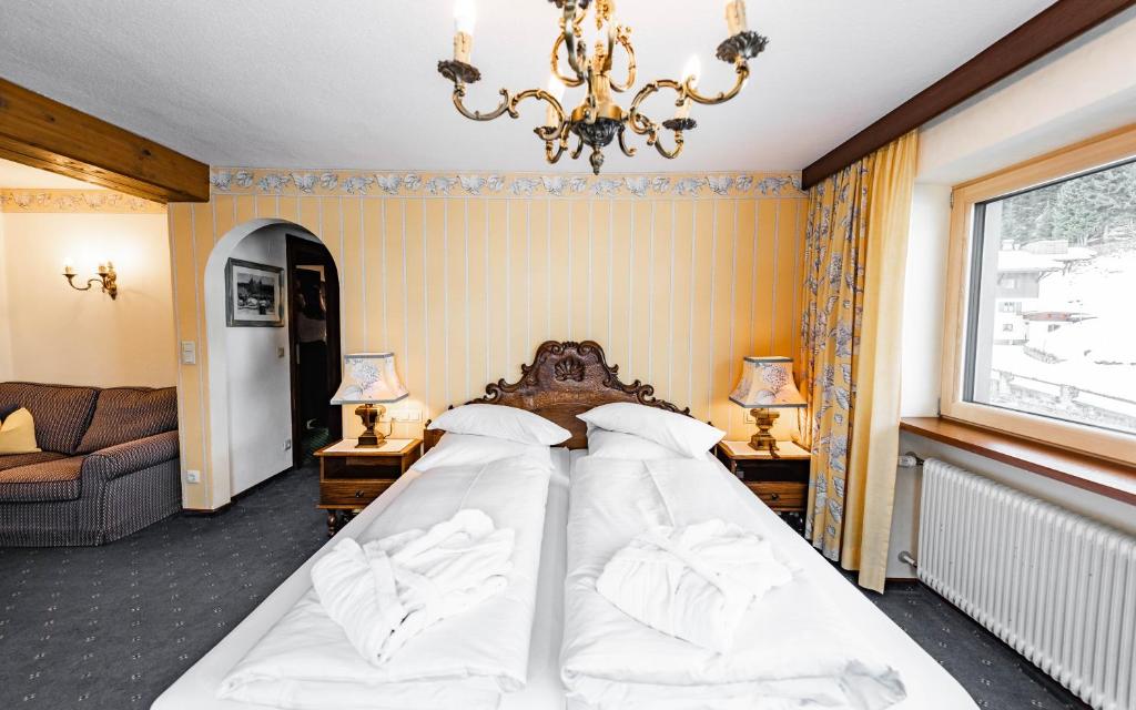 Postel nebo postele na pokoji v ubytování Hotel Olympia