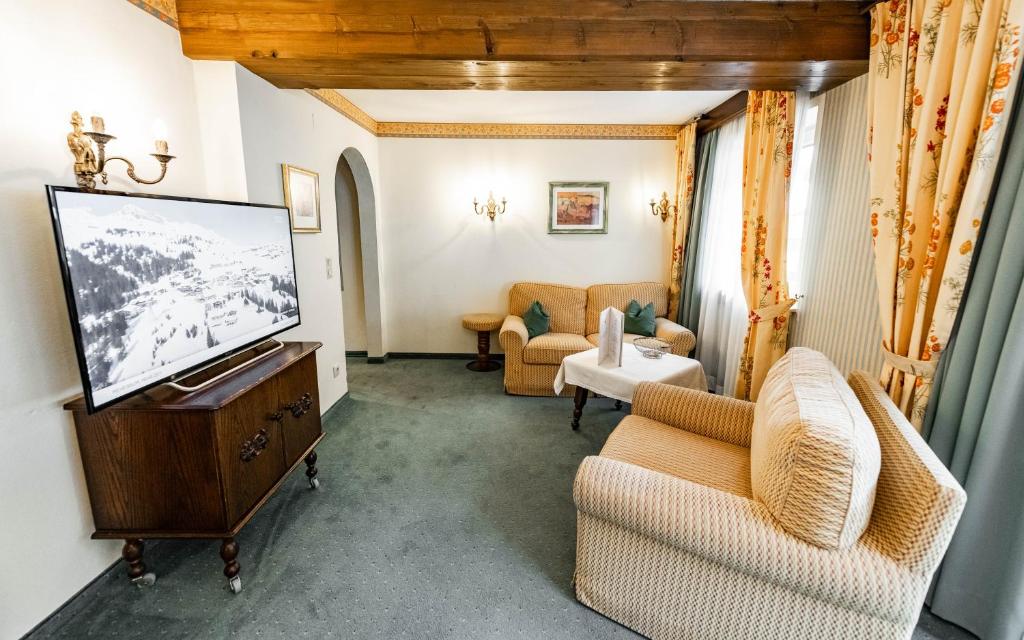 TV a/nebo společenská místnost v ubytování Hotel Olympia