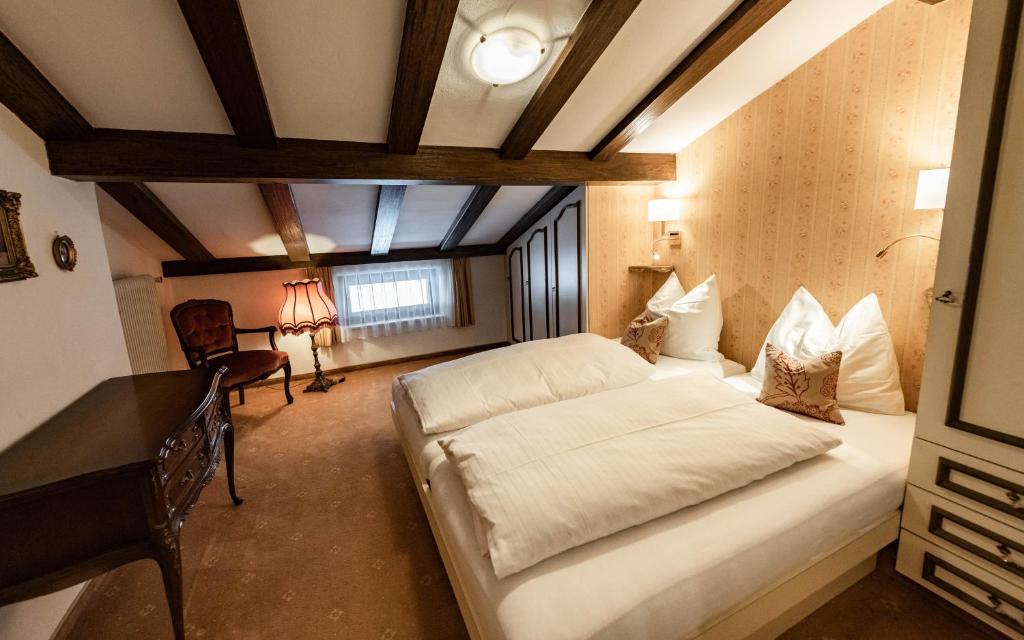 Postel nebo postele na pokoji v ubytování Hotel Olympia
