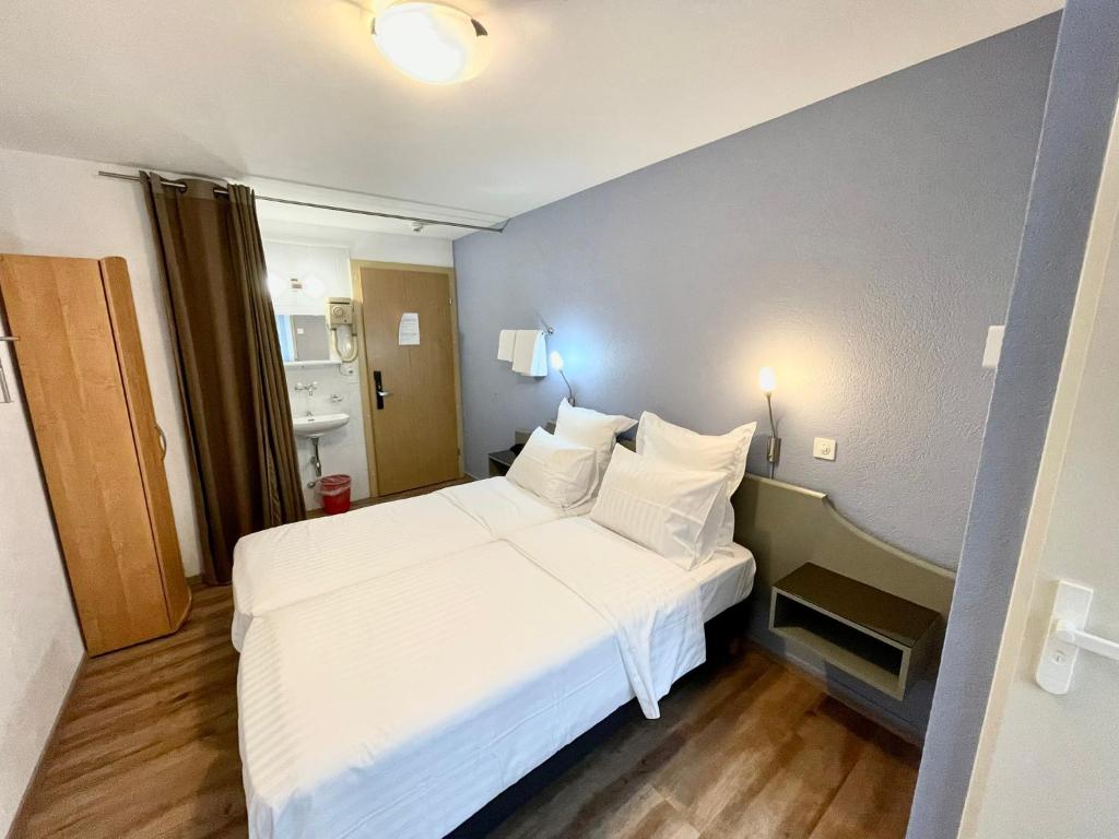 Postel nebo postele na pokoji v ubytování Primadom Aparthotel