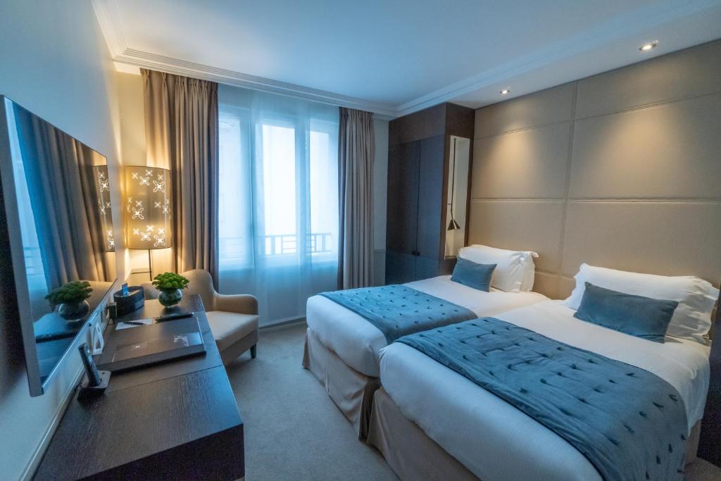 Postel nebo postele na pokoji v ubytování Hotel Villa Saxe Eiffel