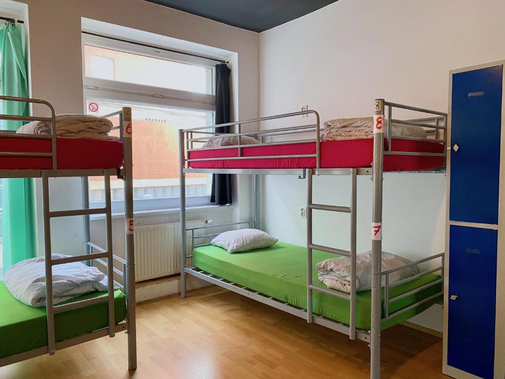 Postel nebo postele na pokoji v ubytování Urban Elephants Hostel