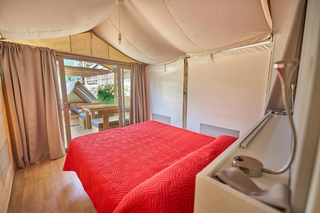 Postel nebo postele na pokoji v ubytování Camping Village Scaglieri