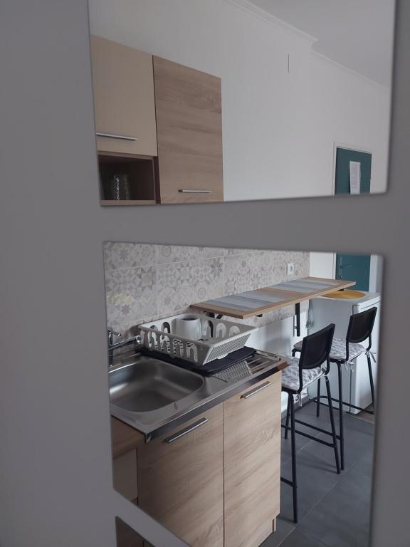 Kuchyň nebo kuchyňský kout v ubytování Scala Studio Apartments