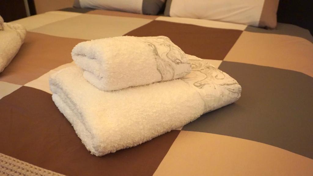 Postel nebo postele na pokoji v ubytování Sweet House 3