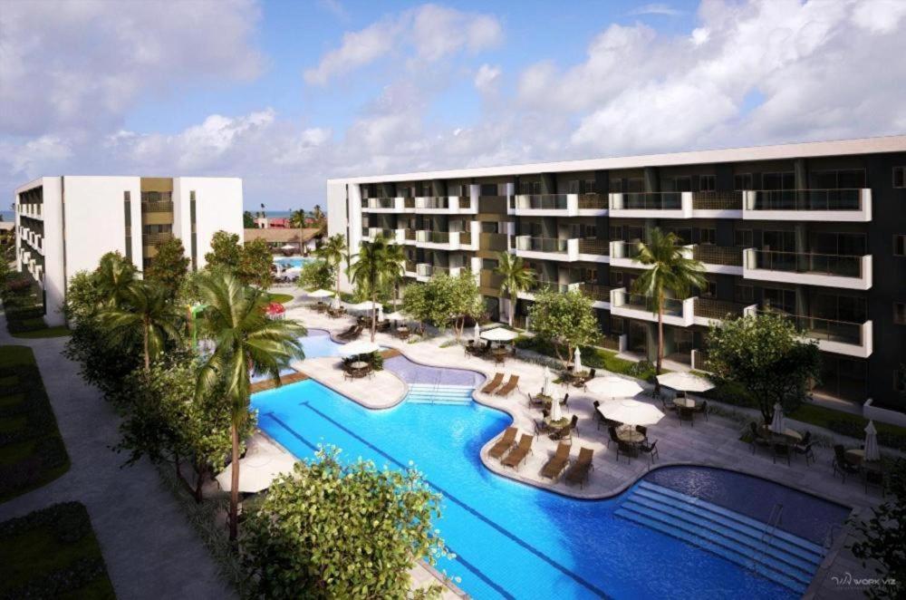 una vista aérea de un hotel con piscina en Mana Beach Resort Muro Alto Prime - Porto de Galinhas, en Porto de Galinhas