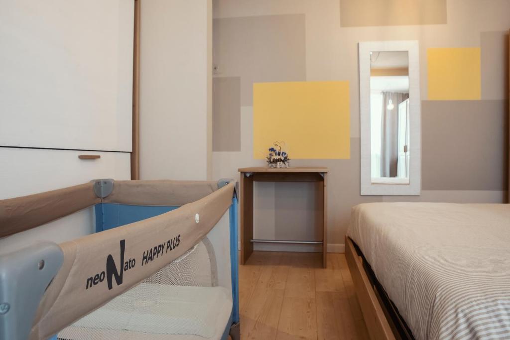 Posteľ alebo postele v izbe v ubytovaní Hotel Laghetto