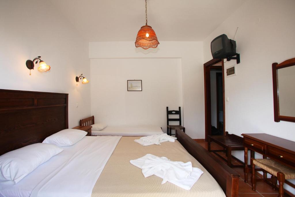 Postel nebo postele na pokoji v ubytování Sun Accommodation