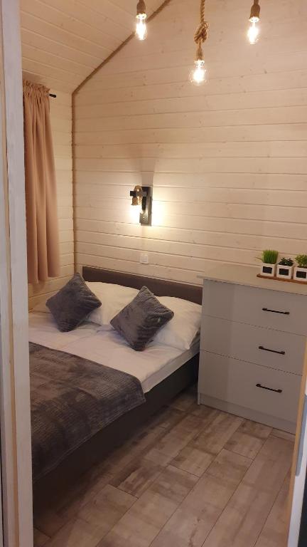 Postel nebo postele na pokoji v ubytování Perła Marzeń