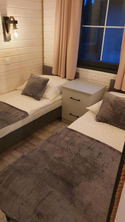 Postel nebo postele na pokoji v ubytování Perła Marzeń