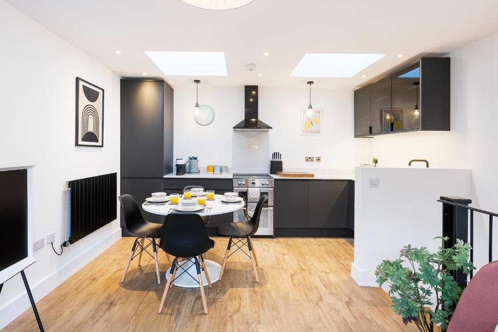a kitchen and dining room with a table and chairs at The Upside Down Eco House in Bristol