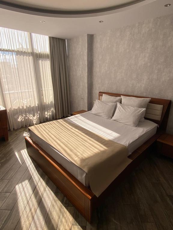 Postel nebo postele na pokoji v ubytování Hotel Light Palace
