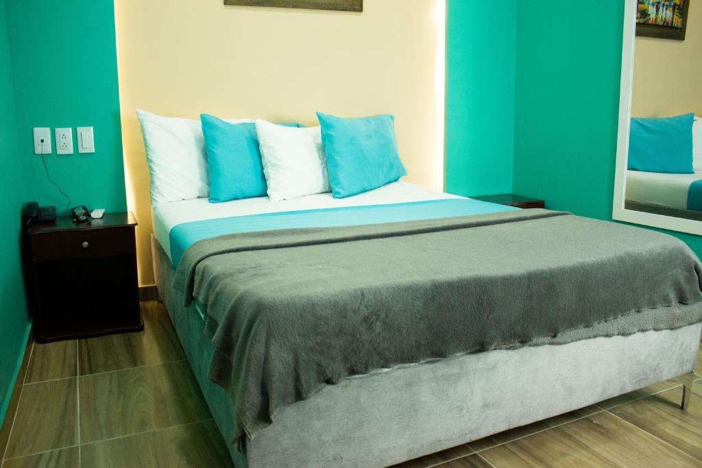 Postel nebo postele na pokoji v ubytování Hotel Brisas De Calima