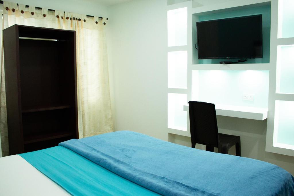 Postel nebo postele na pokoji v ubytování Hotel Brisas De Calima