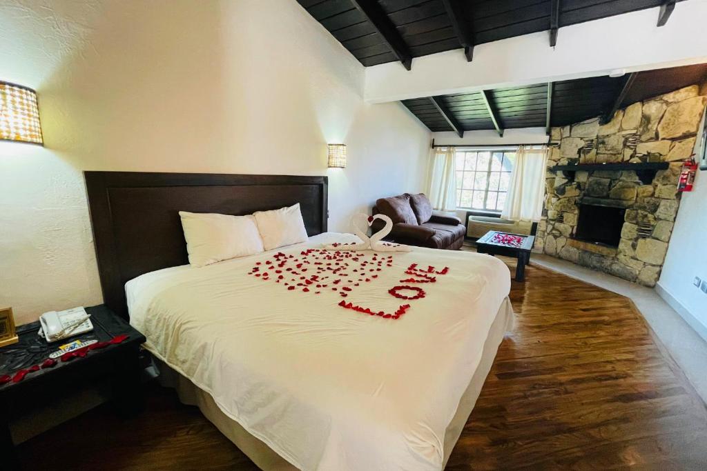 Postel nebo postele na pokoji v ubytování Hotel Chipinque