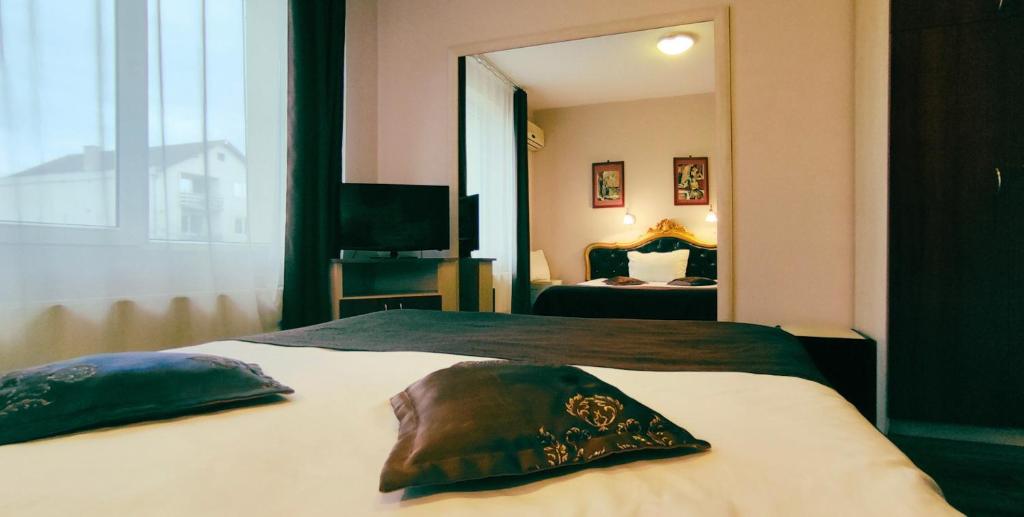 Una cama o camas en una habitación de Vila Europa