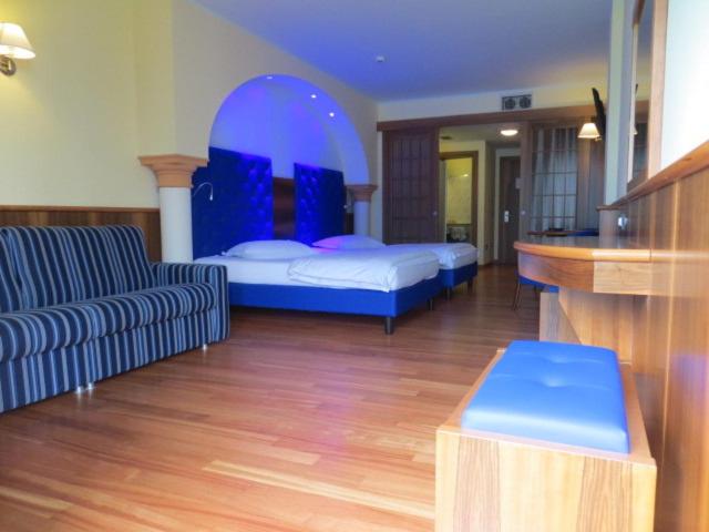 Postel nebo postele na pokoji v ubytování Hotel Alexander