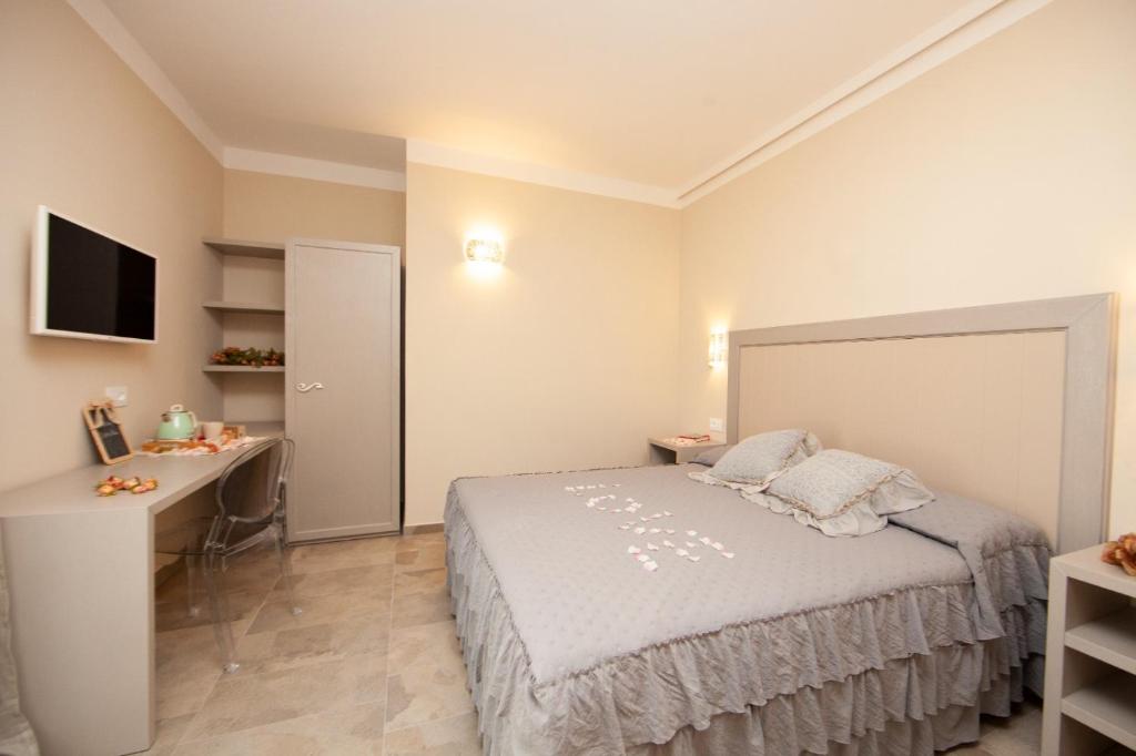 Postel nebo postele na pokoji v ubytování Podere Grandolfi B&B