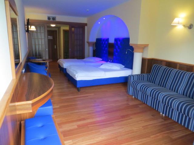 Postel nebo postele na pokoji v ubytování Hotel Alexander