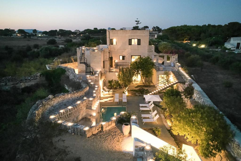 an aerial view of a house at night at Villa Rocce Bianche in Favignana