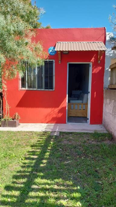 a red house with a window and a door at No RESERVAR CUENTA USURPADA in Manantiales