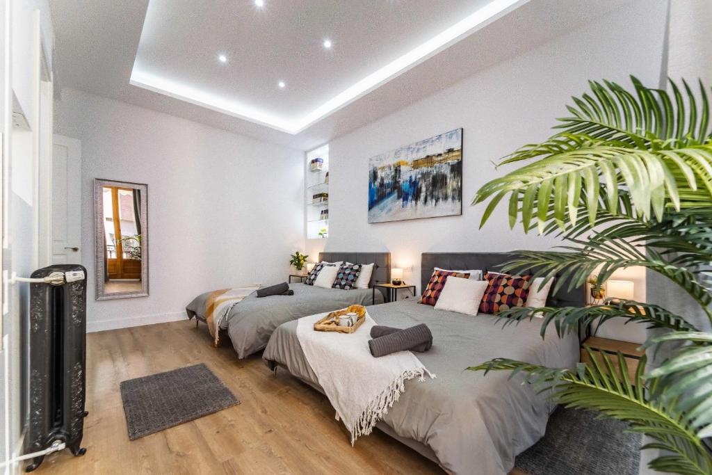 A bed or beds in a room at Premium Apartment La Latina