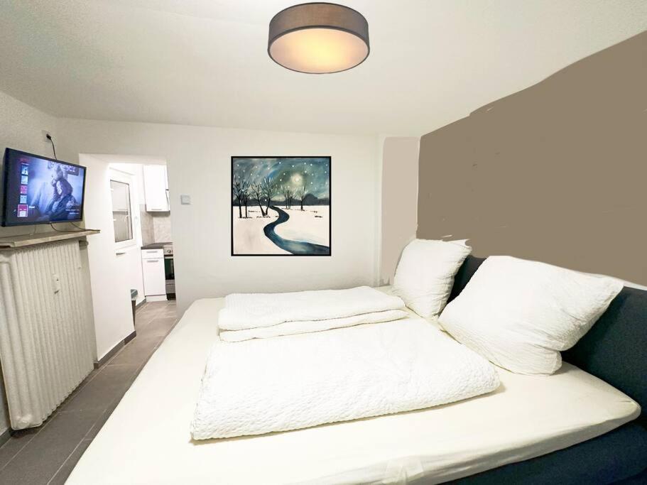 Ένα ή περισσότερα κρεβάτια σε δωμάτιο στο Mini Appartement neben Theater