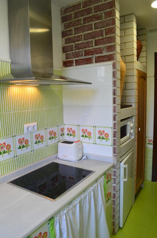 A kitchen or kitchenette at apartamentos y habitaciones Quinta La Espadaña apartamentos y habitaciones Quinta la Espadaña