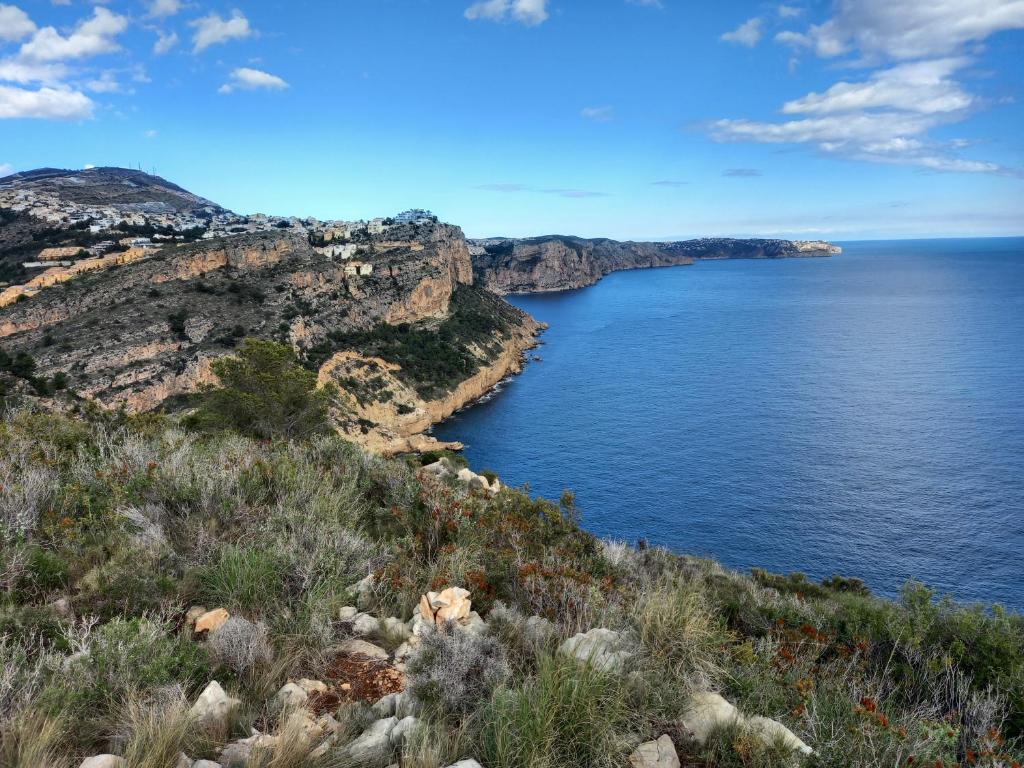 a view of a large body of water on a cliff at la ventana al mar in Jávea