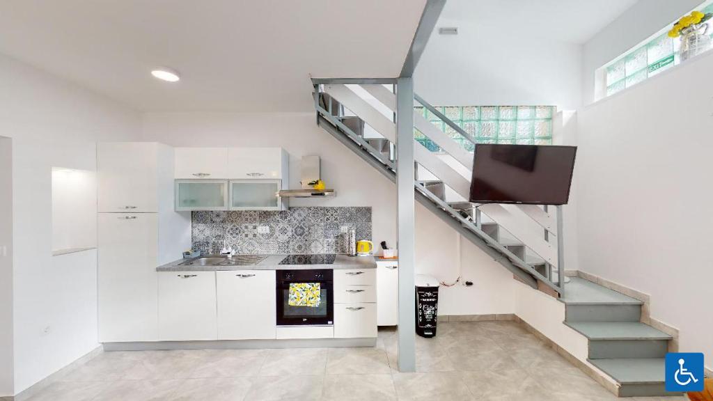 Kuchyň nebo kuchyňský kout v ubytování Apartments Mare