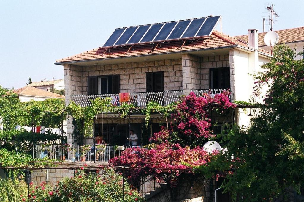 a house with solar panels on the roof at Villa Jadranka in Hvar