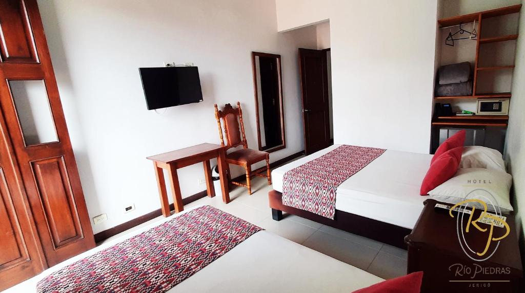 Postel nebo postele na pokoji v ubytování Hotel Rio Piedras
