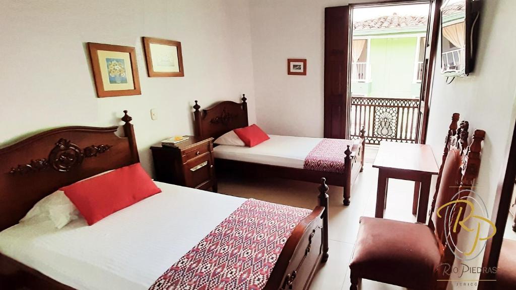 Postel nebo postele na pokoji v ubytování Hotel Rio Piedras