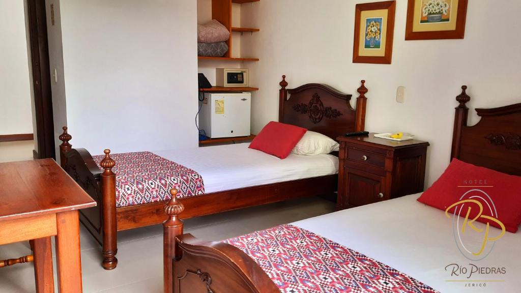 Postel nebo postele na pokoji v ubytování Hotel Rio Piedras