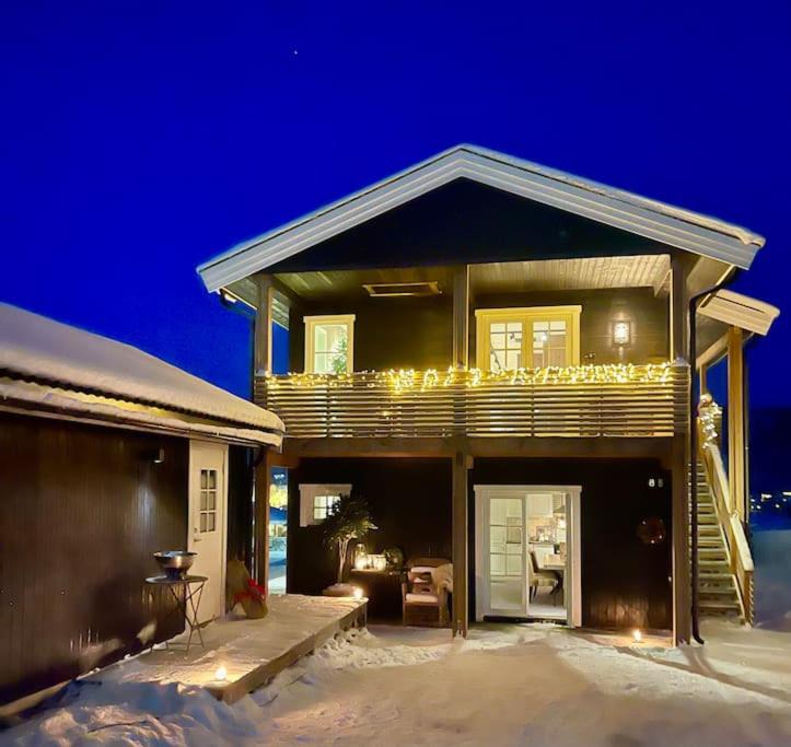 a house with lights on top of it in the snow at New apartment near the lifts tourist center Trysil in Trysil