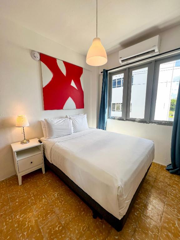 Postel nebo postele na pokoji v ubytování Urbana Hotel