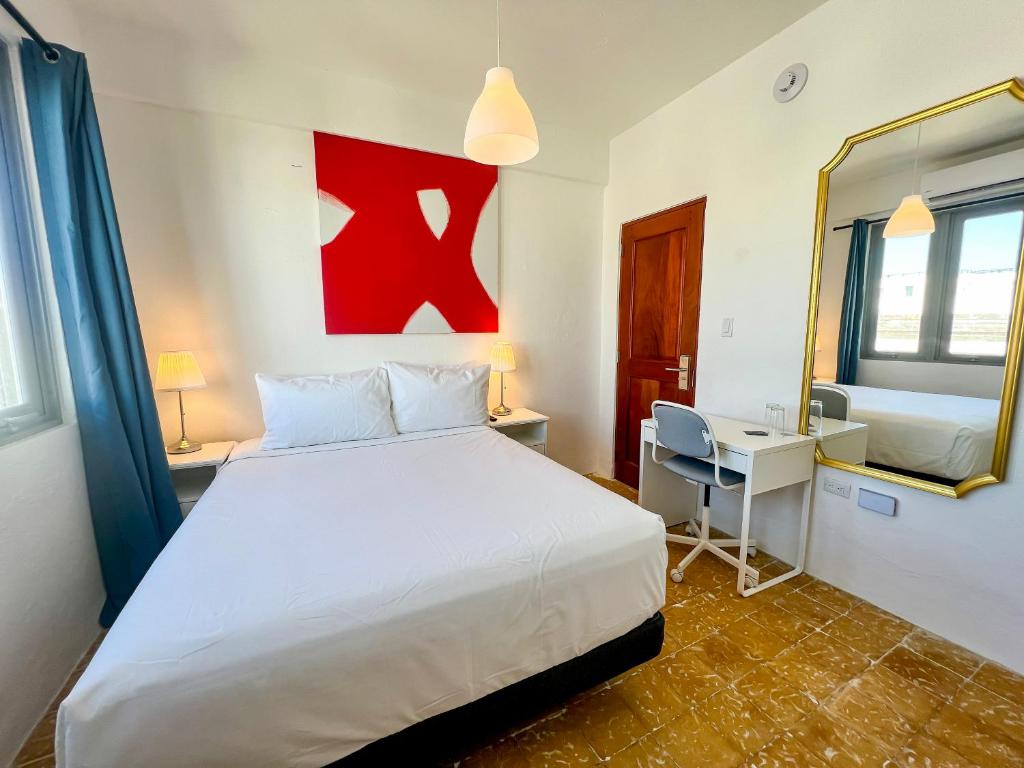 Postel nebo postele na pokoji v ubytování Urbana Hotel