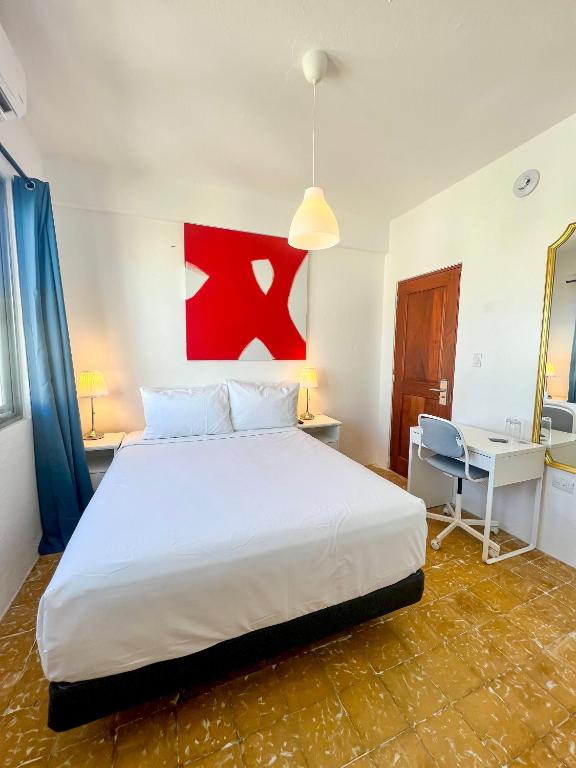Postel nebo postele na pokoji v ubytování Urbana Hotel