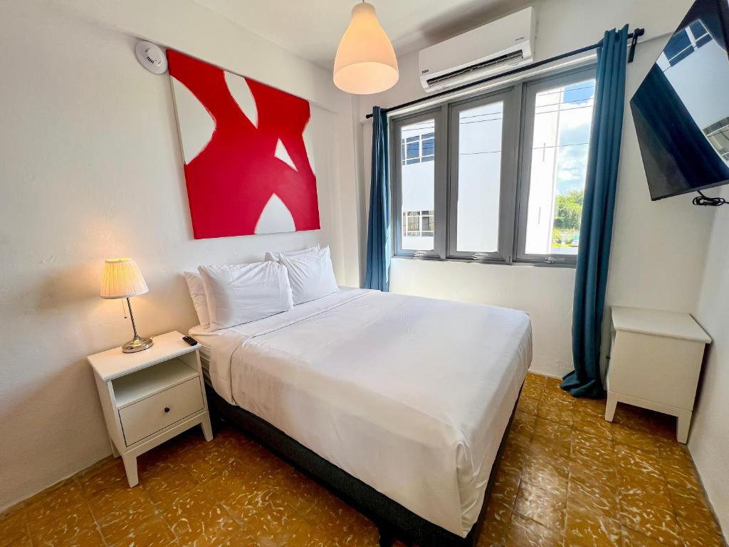 Postel nebo postele na pokoji v ubytování Urbana Hotel