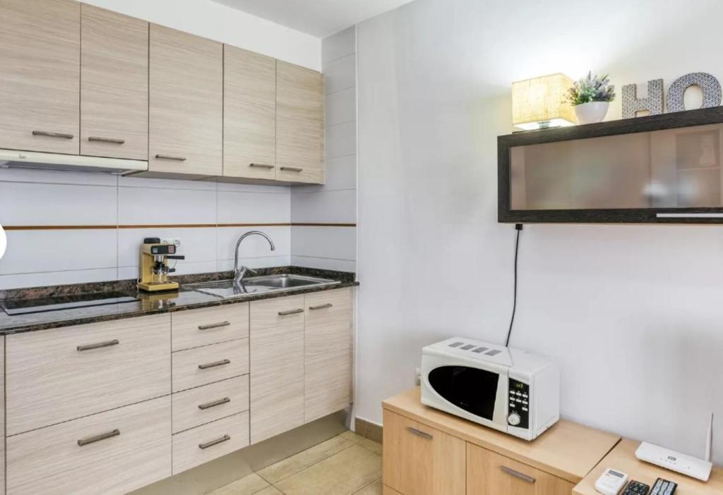 Kuchyň nebo kuchyňský kout v ubytování Apartamento vistas panorámicas