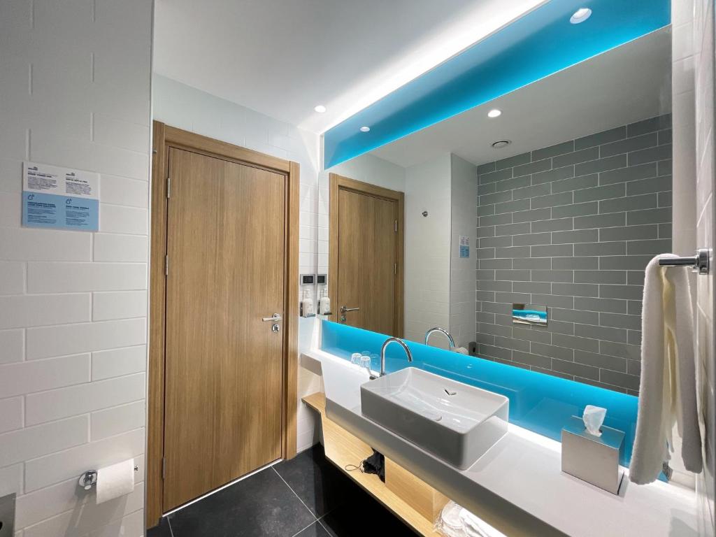 a bathroom with a sink and a mirror at Holiday Inn Express - Ankara - Airport by IHG in Ankara