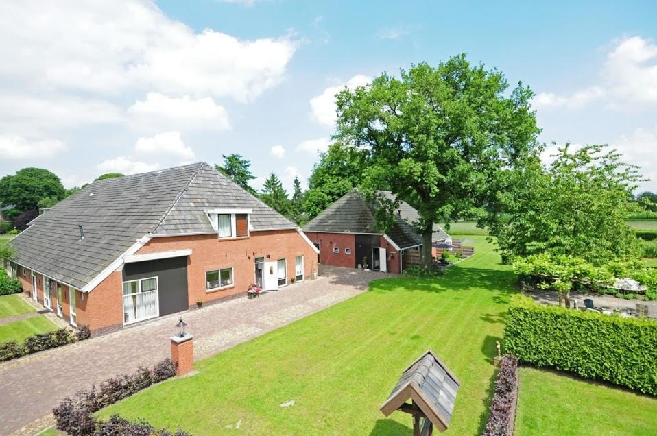 an aerial view of a house with a large yard at 't Rond Bargie in Exloo