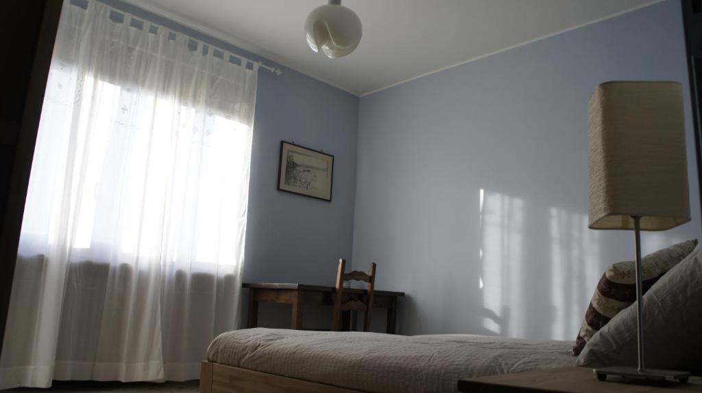 Postel nebo postele na pokoji v ubytování Il Piccione Viaggiatore