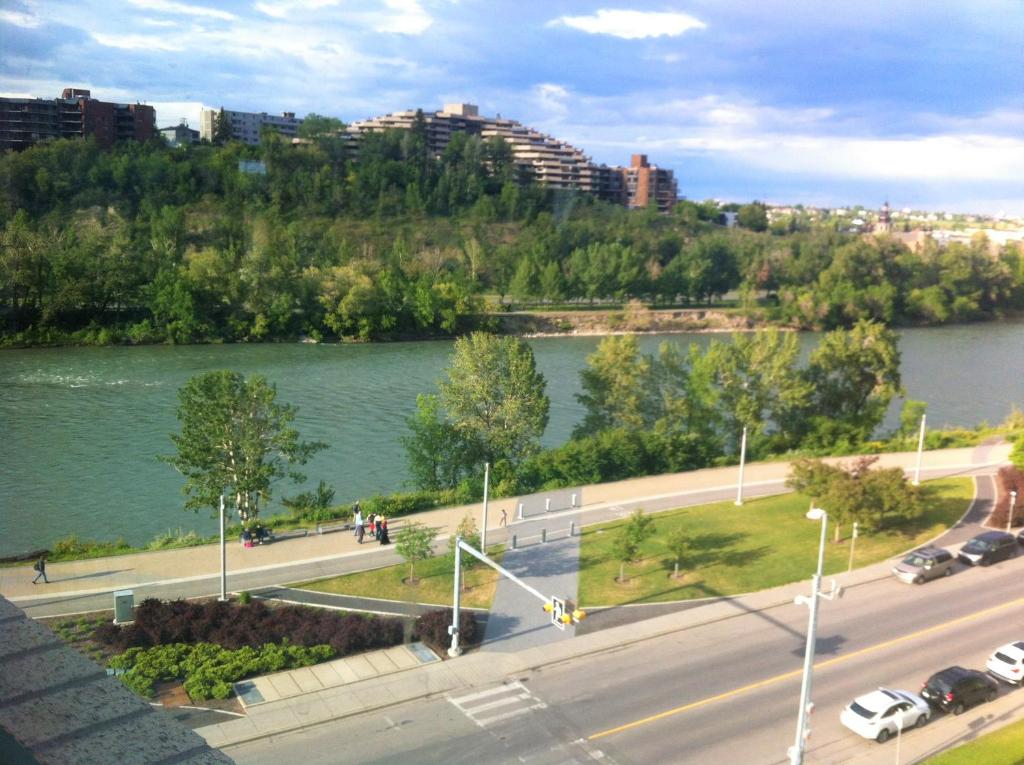 a view of a river and a city with buildings at Amicable, Cozy, High Speed Internet, Sleeps 2 Riverview Downtown Apartment in Calgary